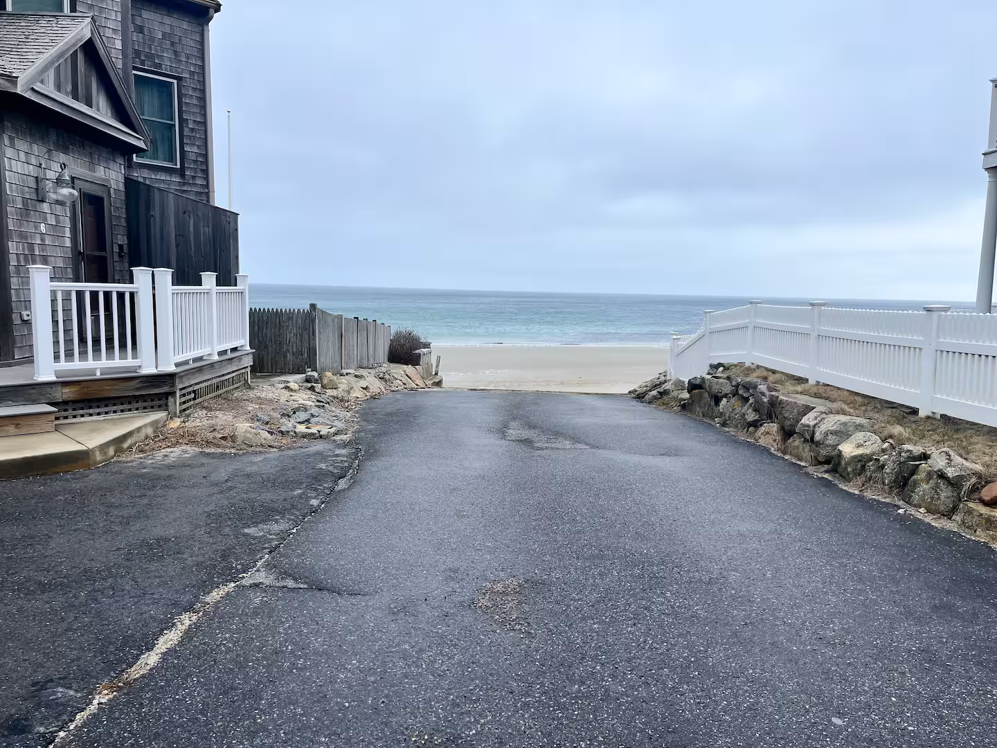 The entrance path to Arnold Beach in the Manomet section of Plymouth, Massachusetts, leading down to the sand on Cape Cod Bay
