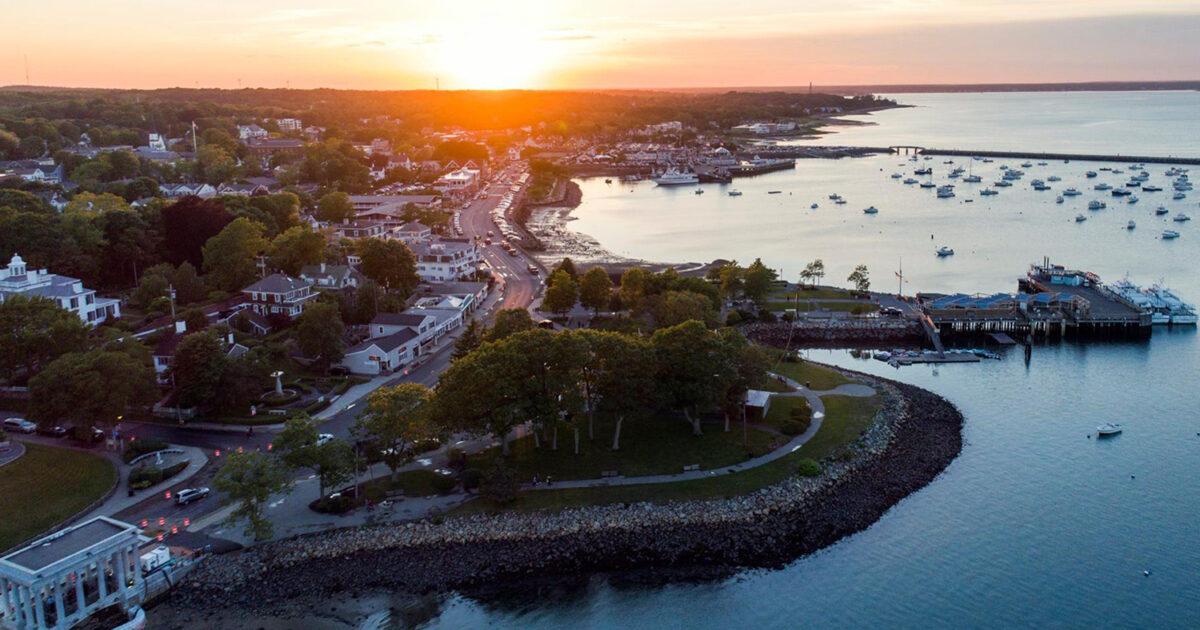 Aerial view of Plymouth harbor and waterfront at sunset